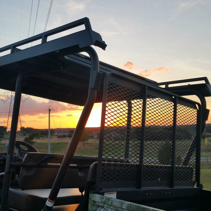 Mule Trans metal roof with rear view bottom-side view of dump bed door open