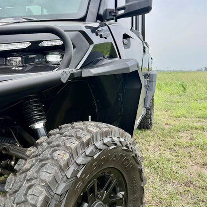 Can-Am Defender HD11 aluminum fender flares installed on a UTV for added mud and debris protection.