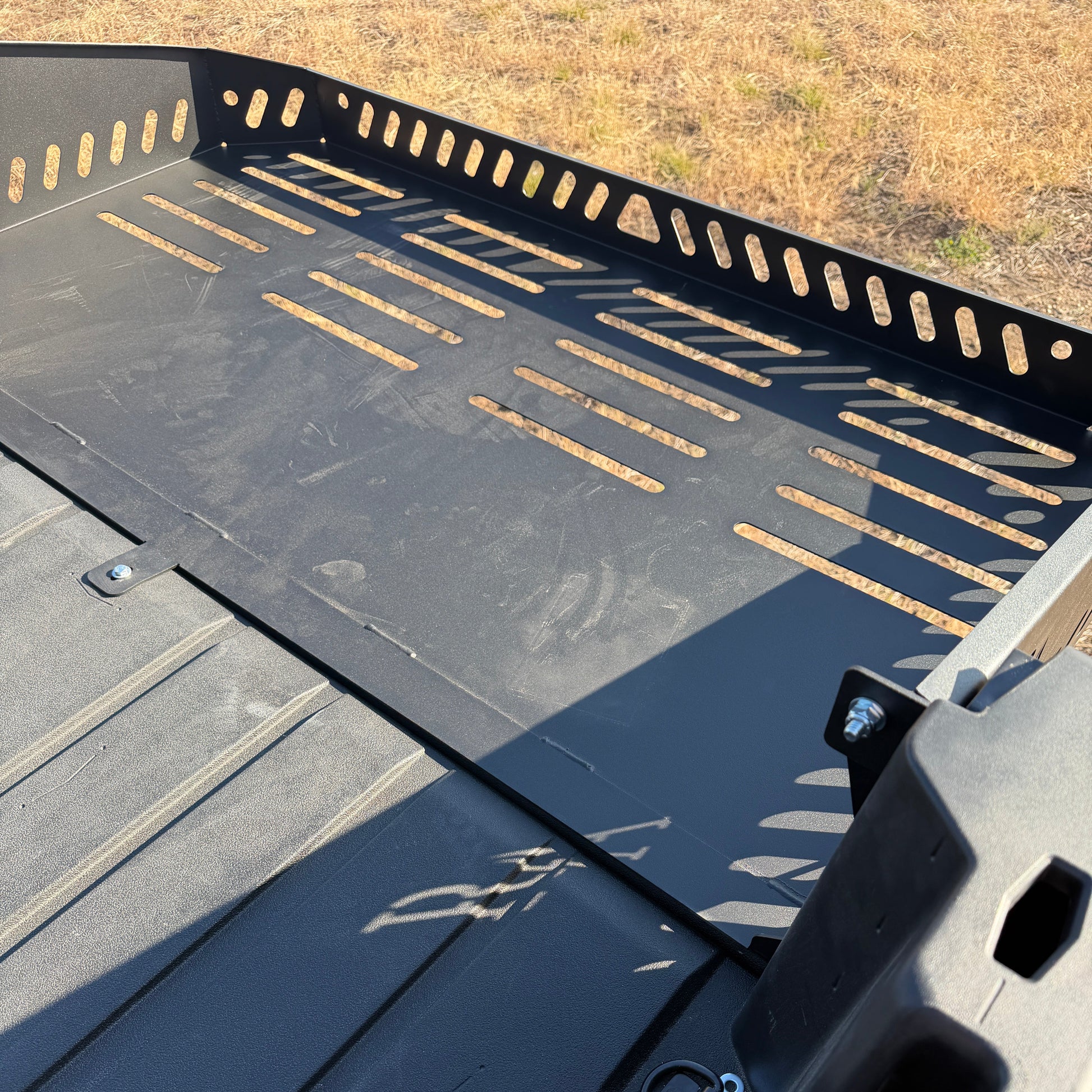 Can-Am Defender HD11 bed extension installed on UTV cargo bed for increased hauling capacity