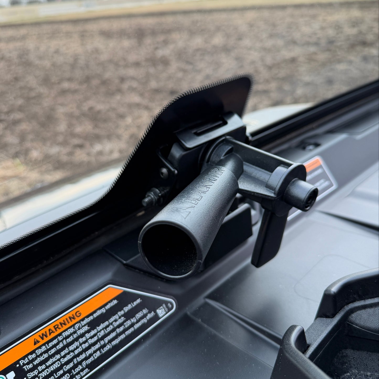 Clear Can-Am tip-out glass windshield designed for OEM fit, enhanced weather sealing, and adjustable open or vent positions.