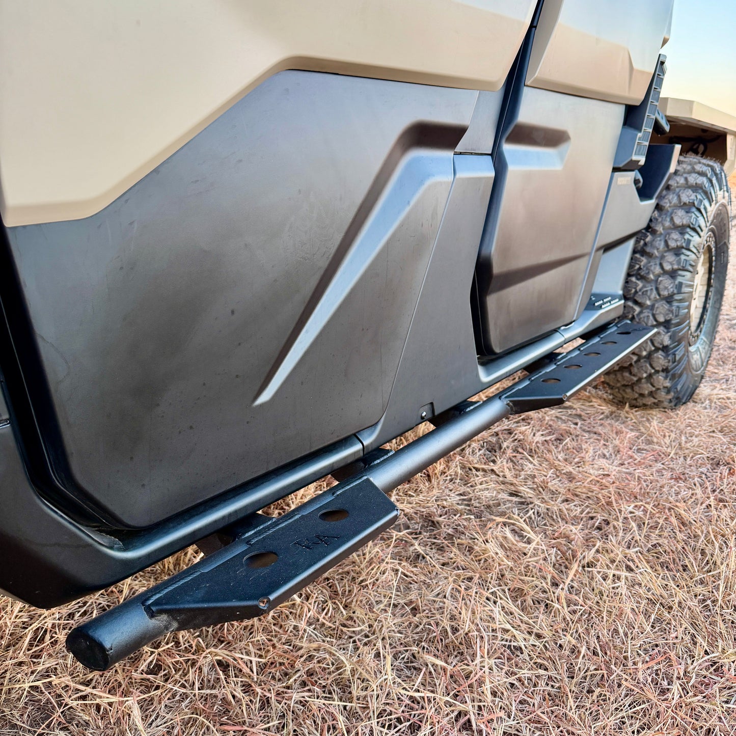 Close-up of Whiskey Alpha’s custom steel armor paneling on the 2026 Can-Am Defender HD11.