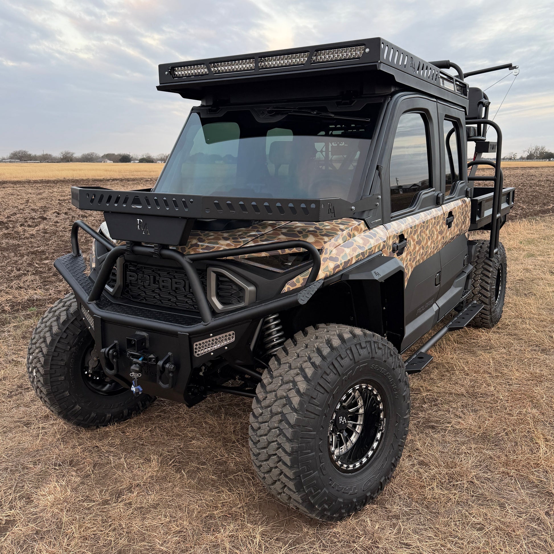 Close-up of custom wheels and off-road tires on Polaris Ranger 1500 Project Kudu build