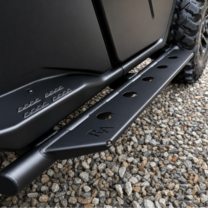 Close-up of non-slip step plates on 2026 Can-Am Defender HD11 side steps for secure footing in mud and wet conditions