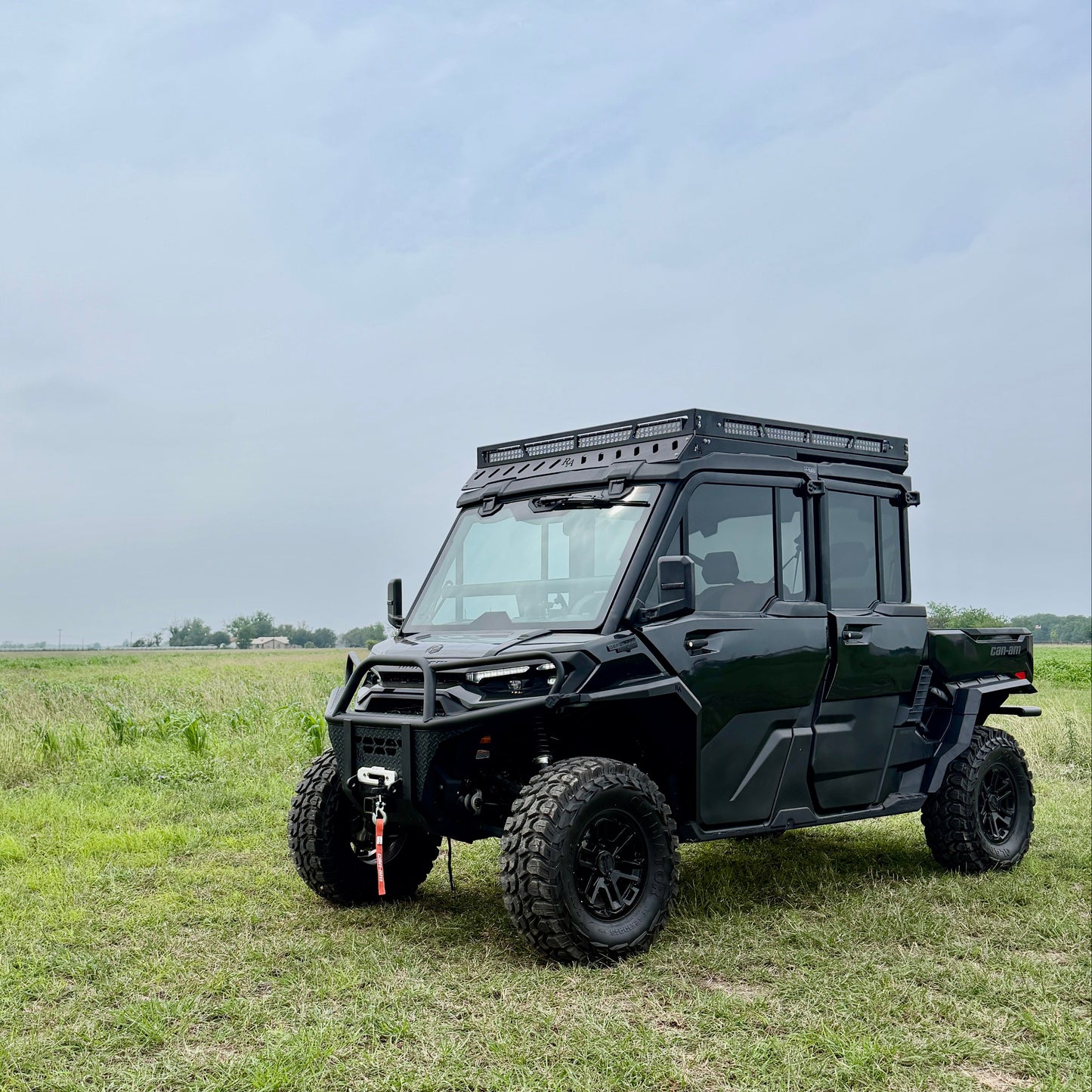 Custom-fit Can-Am Defender HD11 aluminum fender flares extending wheel coverage for off-road riding.
