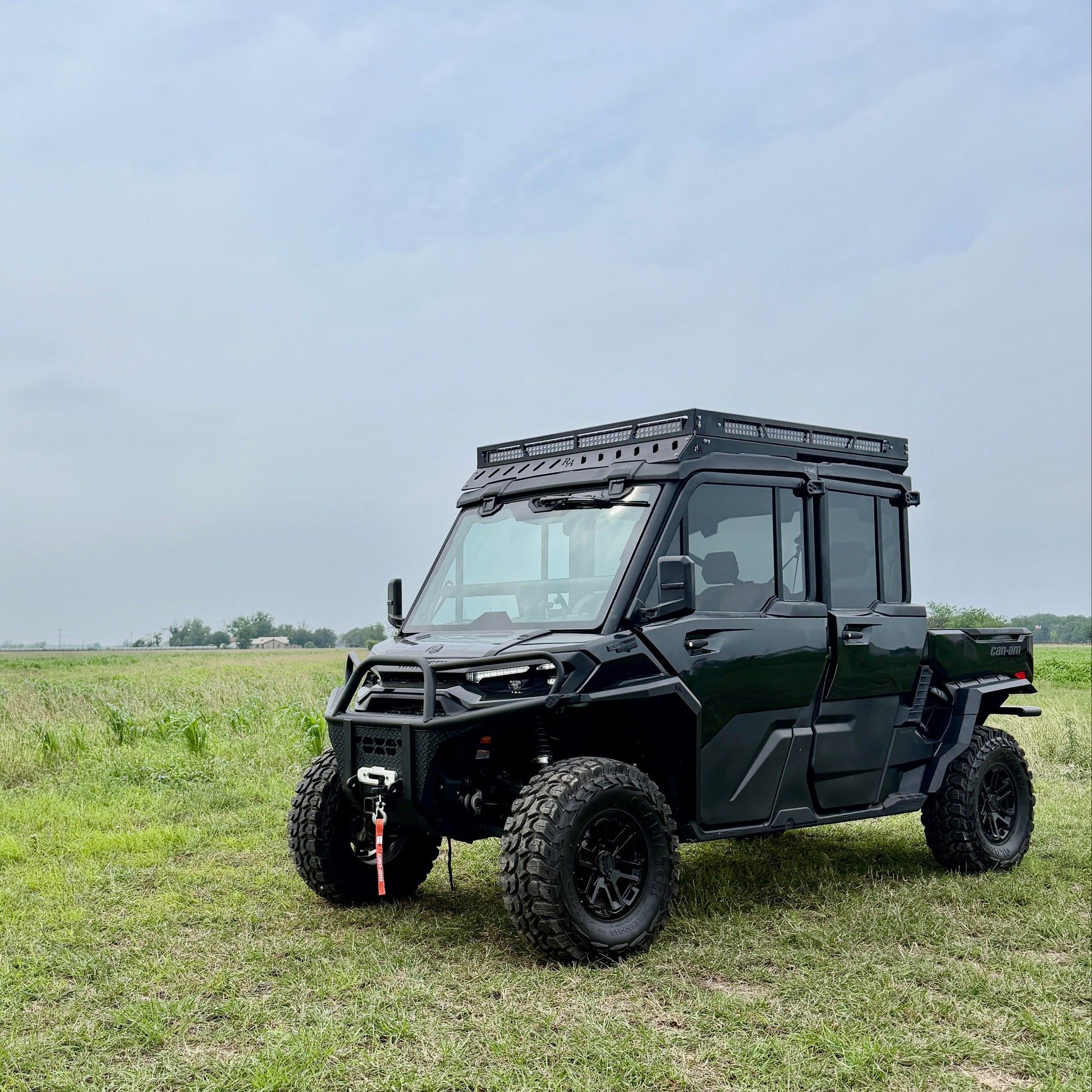 Custom-fit Can-Am Defender HD11 aluminum fender flares extending wheel coverage for off-road riding.