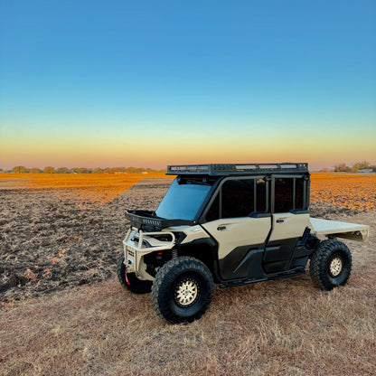 Custom Can-Am Defender HD11 Project Whiskey Alpha with premium steel protection, aggressive tires, and performance accessories—side profile.