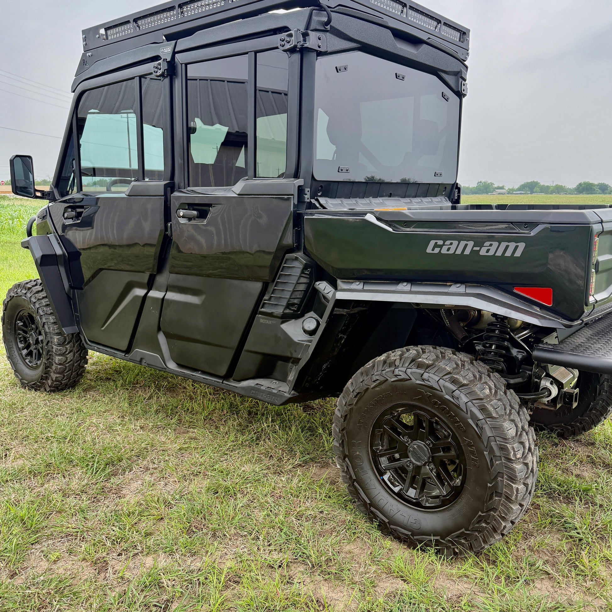 Durable aluminum fender flares for Can-Am Defender HD11 protecting the cab from mud, rocks, and trail debris.