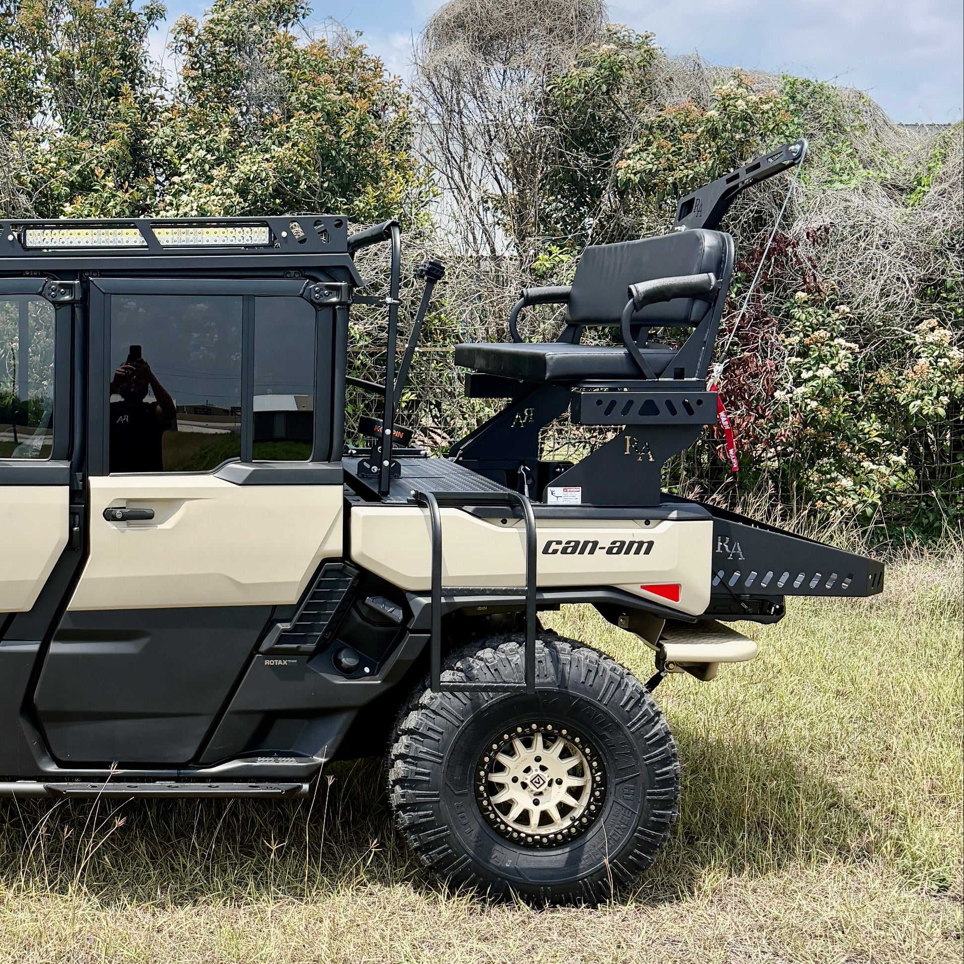 Elevated hunting seat for Can-Am Defender HD11 featuring 18-inch foot platform and marine-grade cushion