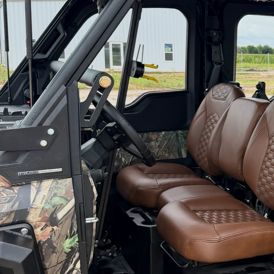 Front-mounted rifle storage system for Polaris Ranger XD 1500 A/C providing safe, accessible firearm transportation.