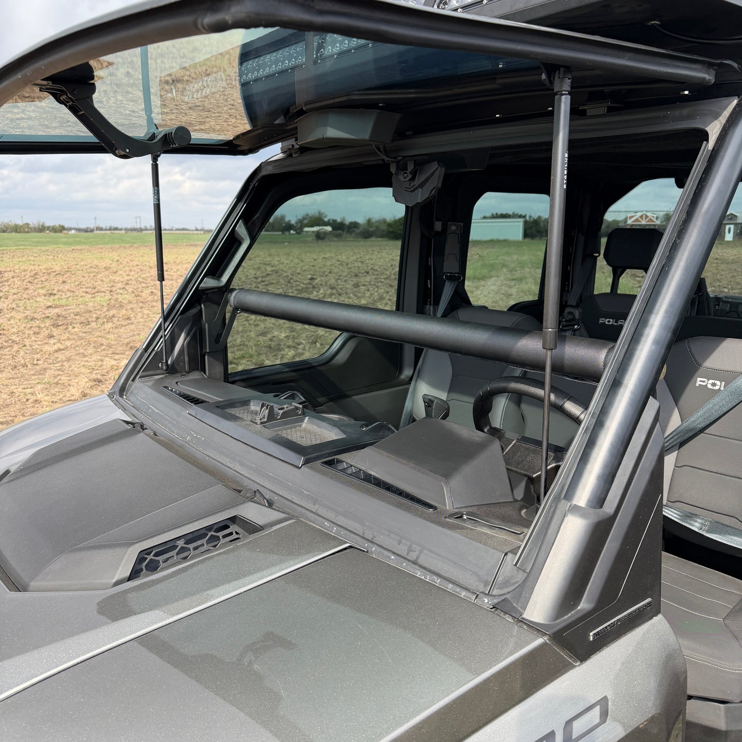 Heavy-duty Ranch Armor rifle mount fitted inside Polaris Ranger 1500 cabin.
