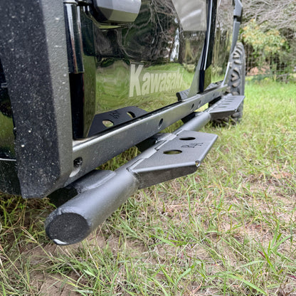 Kawasaki Ridge side steps installed on green UTV with heavy-duty steel nerf bars