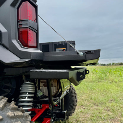 Kawasaki Ridge with RS Series rear bumper protecting dump bed during off-road use