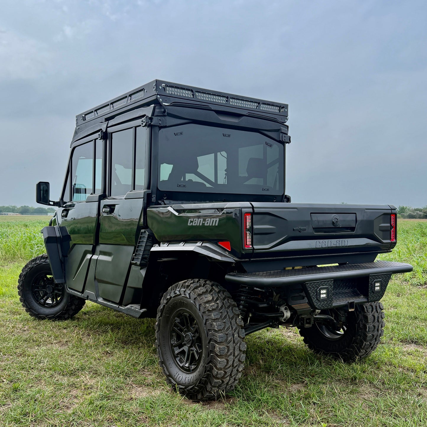Off-road Can-Am Defender HD11 equipped with aftermarket aluminum fender flares for enhanced protection.