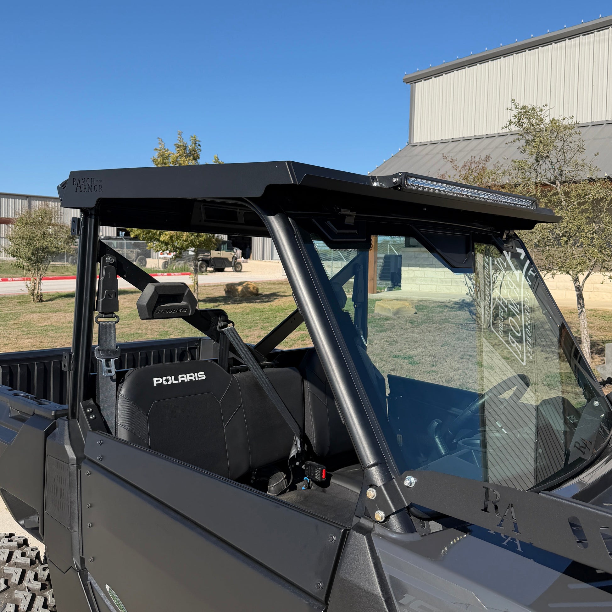 Polaris Ranger 1000 equipped with rugged metal top for improved shade and durability