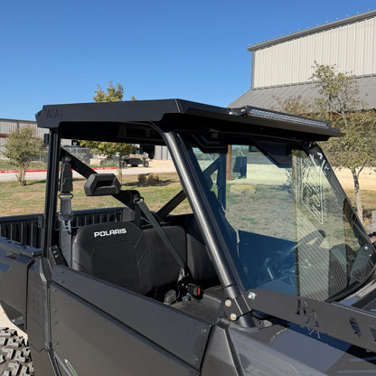 Polaris Ranger 1000 equipped with rugged metal top for improved shade and durability