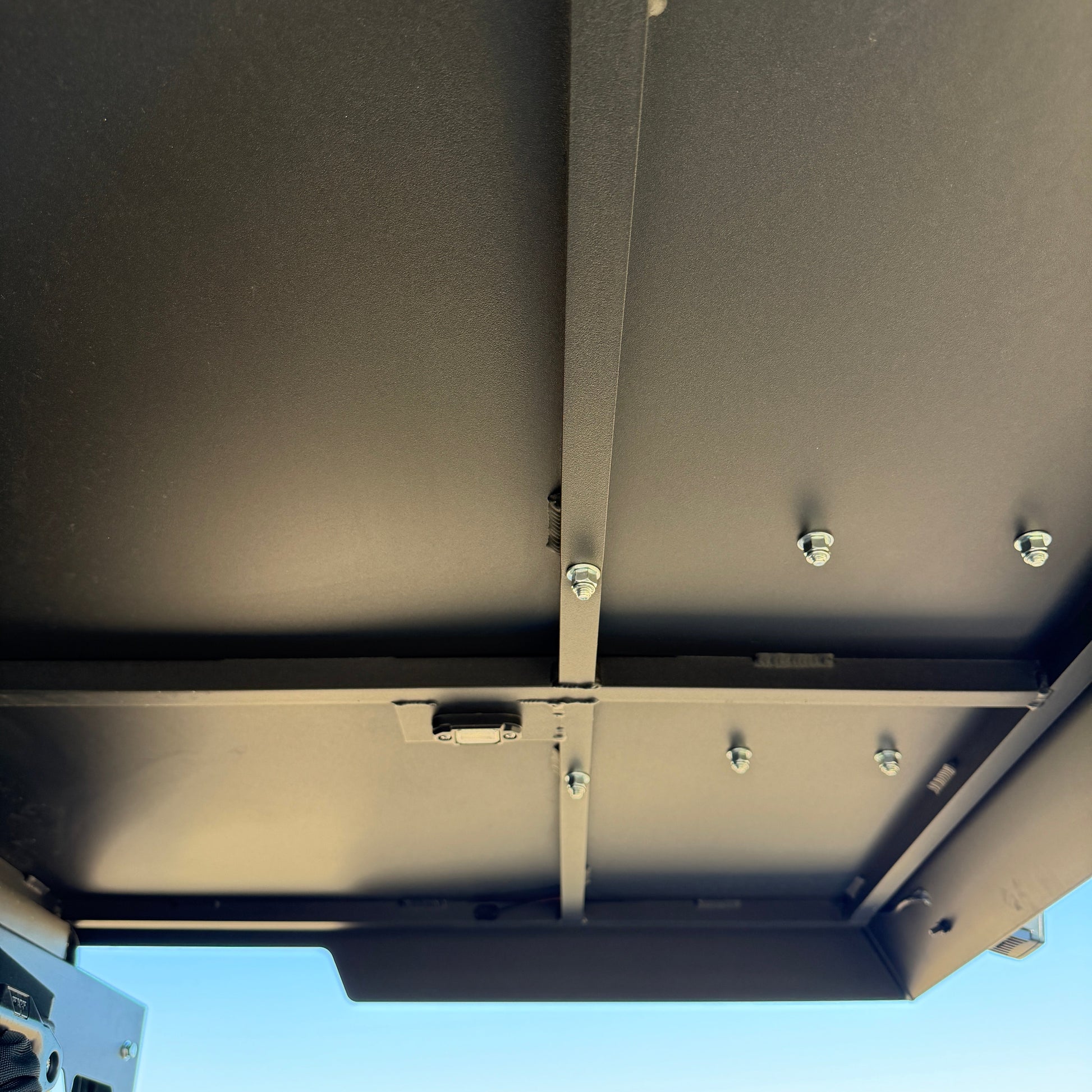 Polaris Ranger 1000 featuring full-length aluminum top extending over cargo bed