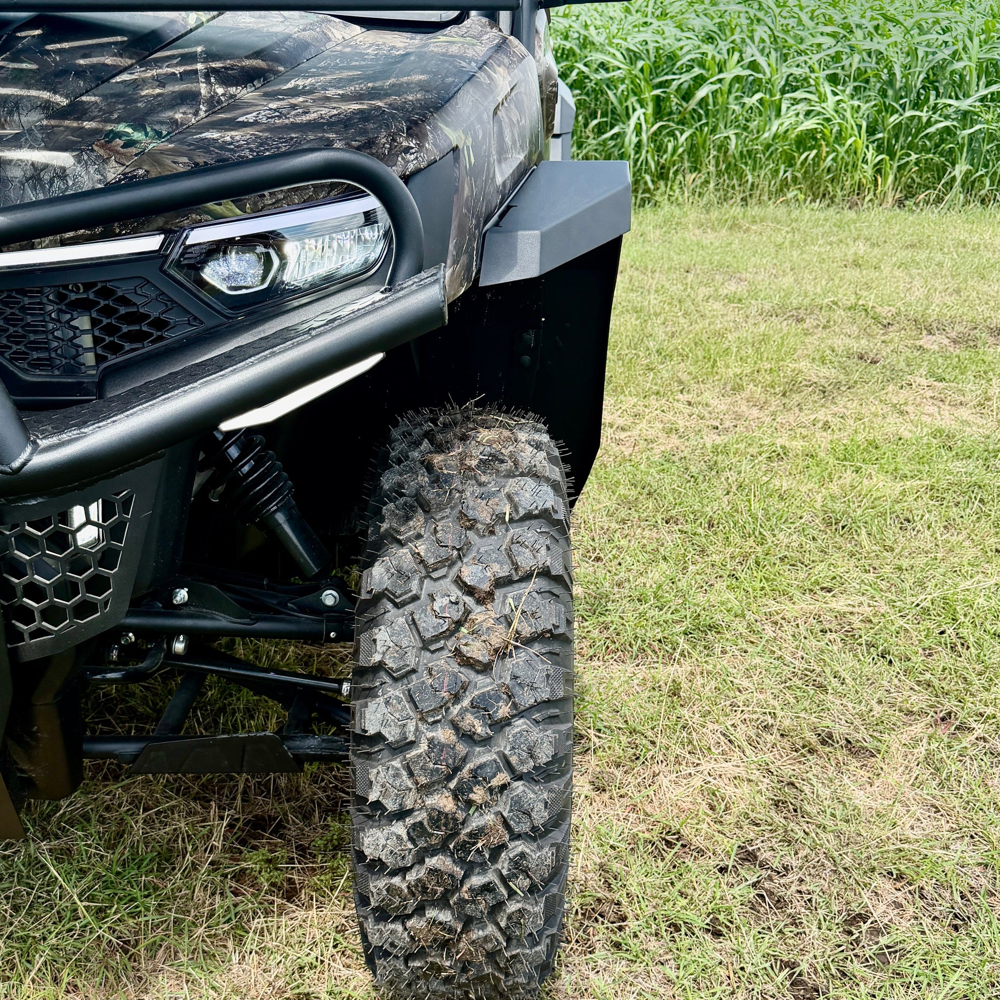Powder-coated CFMoto U10 fender flares protecting against rocks, mud, and trail debris
