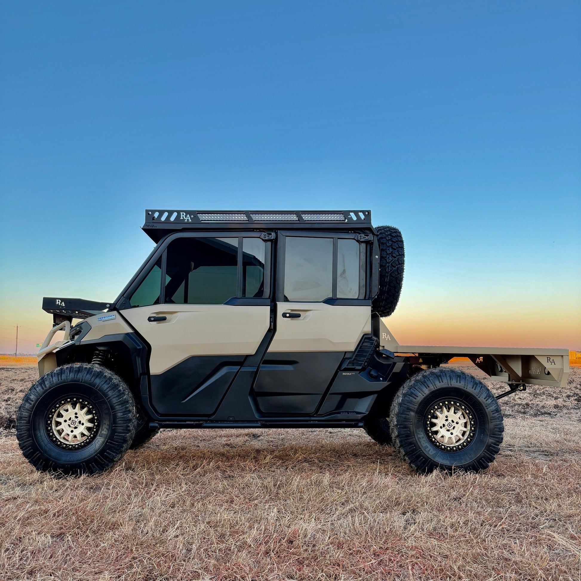 Project Whiskey Alpha Can-Am Defender HD11 showcasing custom doors, skid plating, and a heavy-duty off-road stance.