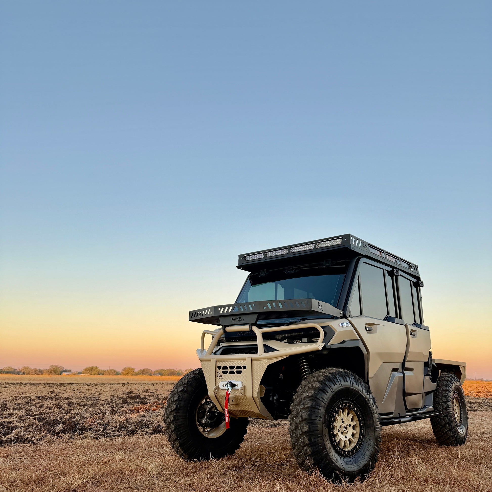 Project Whiskey Alpha customized 2026 Can-Am Defender HD11 featuring heavy-duty protection, roof rack, and off-road performance components.