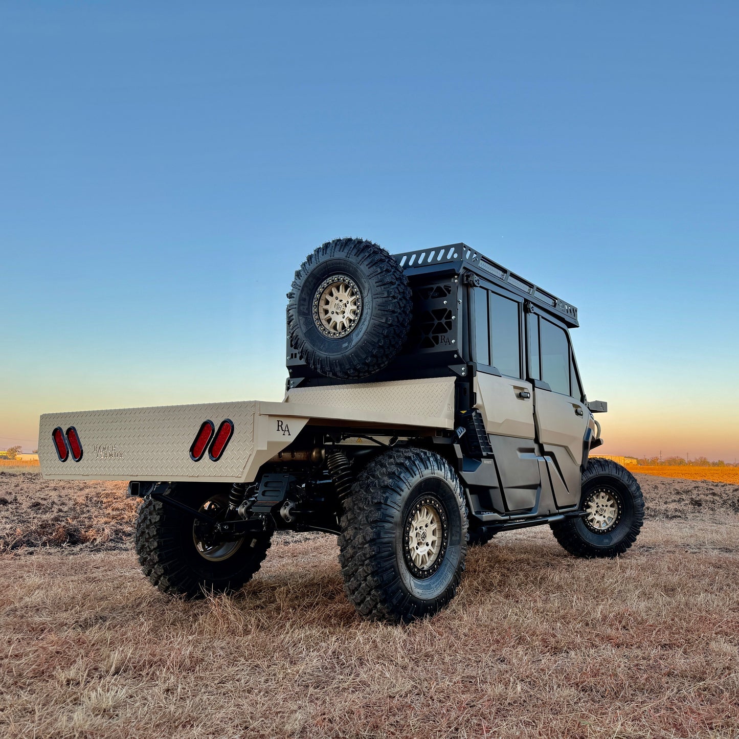 Rear angle of the Project Whiskey Alpha Can-Am Defender HD11 with upgraded cargo bed accessories and protective rear bumper.