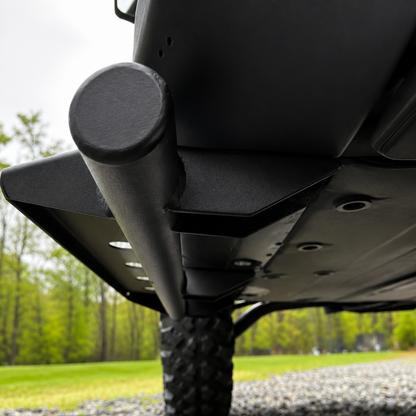 Rugged steel side steps mounted on Can-Am Defender HD11 Single Cab protecting rocker panels from rocks and trail debris