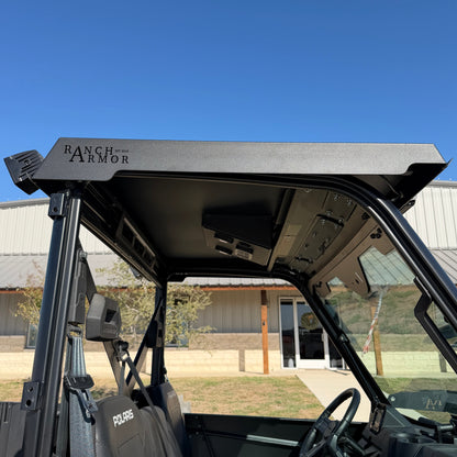 Single cab Polaris Ranger 1000 featuring durable steel metal top for all-weather protection