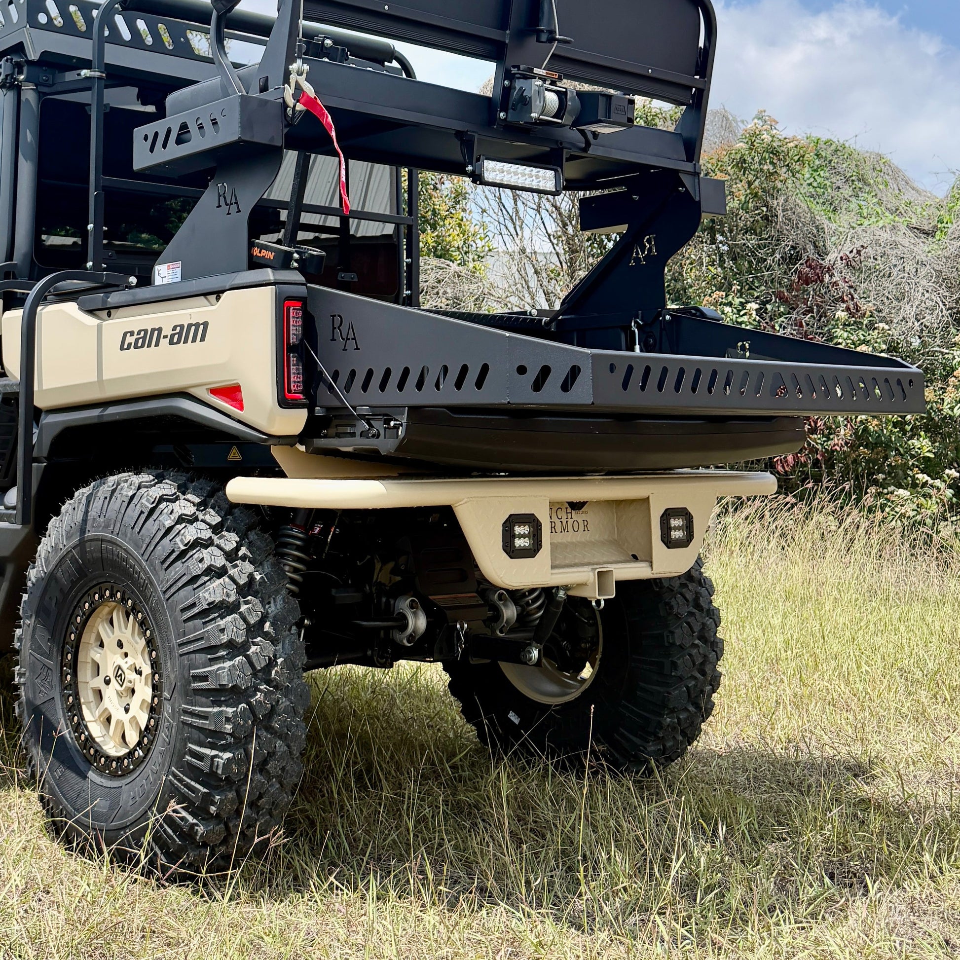 Tan Ranch Armor rear bumper installed on a Can-Am Defender HD11, providing rugged rear-end protection and a durable powder-coated finish for off-road use.